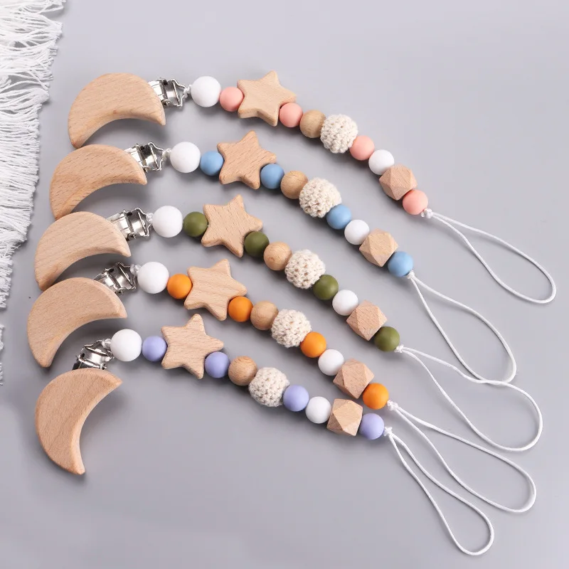 赤ちゃんのためのパーソナライズされた木製のおしゃぶりチェーン - Baby Teethers のレビューと価格